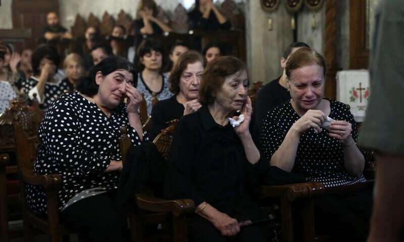 Christian Palestinian mourners attend the funeral ceremony of Saad Salameh and Foumia Ayyad, killed earlier in an Israeli strike that hit the Holy Family Church in Gaza City, at the Saint Porphyrius Church on July 17. &mdash; AFP
