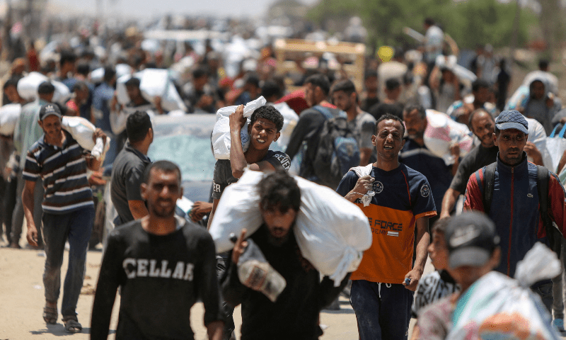 Palestinians collect aid supplies from the US-backed Gaza Humanitarian Foundation, in Rafah, in the southern Gaza Strip, on June 9, 2025. — Reuters