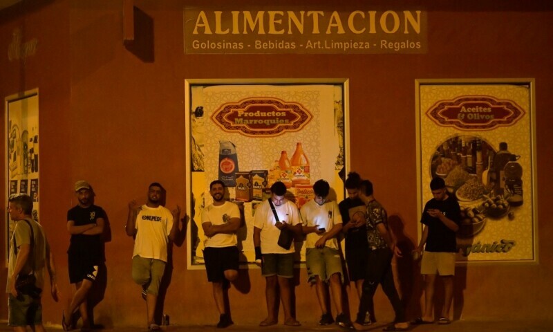 Youngsters stand in San Antonio district in Torre Pacheco, southeastern Spain, on July 15, as a rally has been called by far-right groups following four days of anti-migrant unrest. — AFP