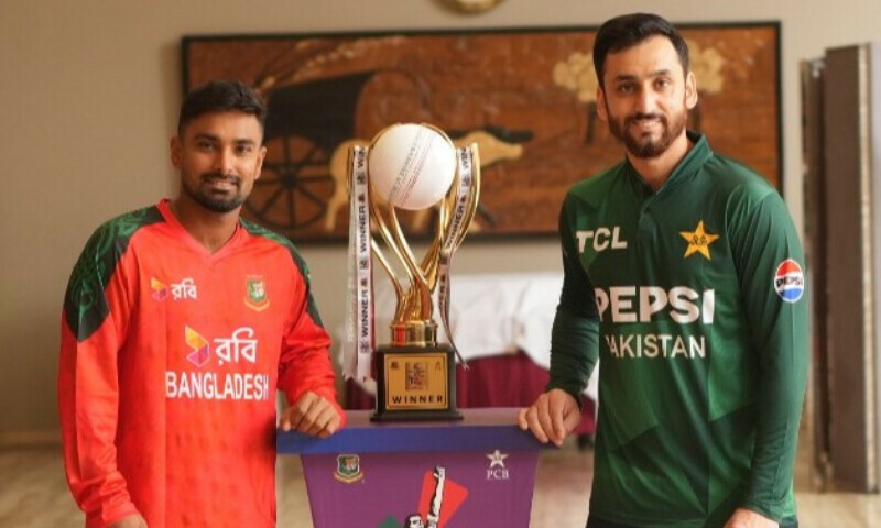Pakistan T20 skipper Salman Ali Agha [R] along with Bangladesh captain Litton Das with the series trophy on July 19. — X/PCB