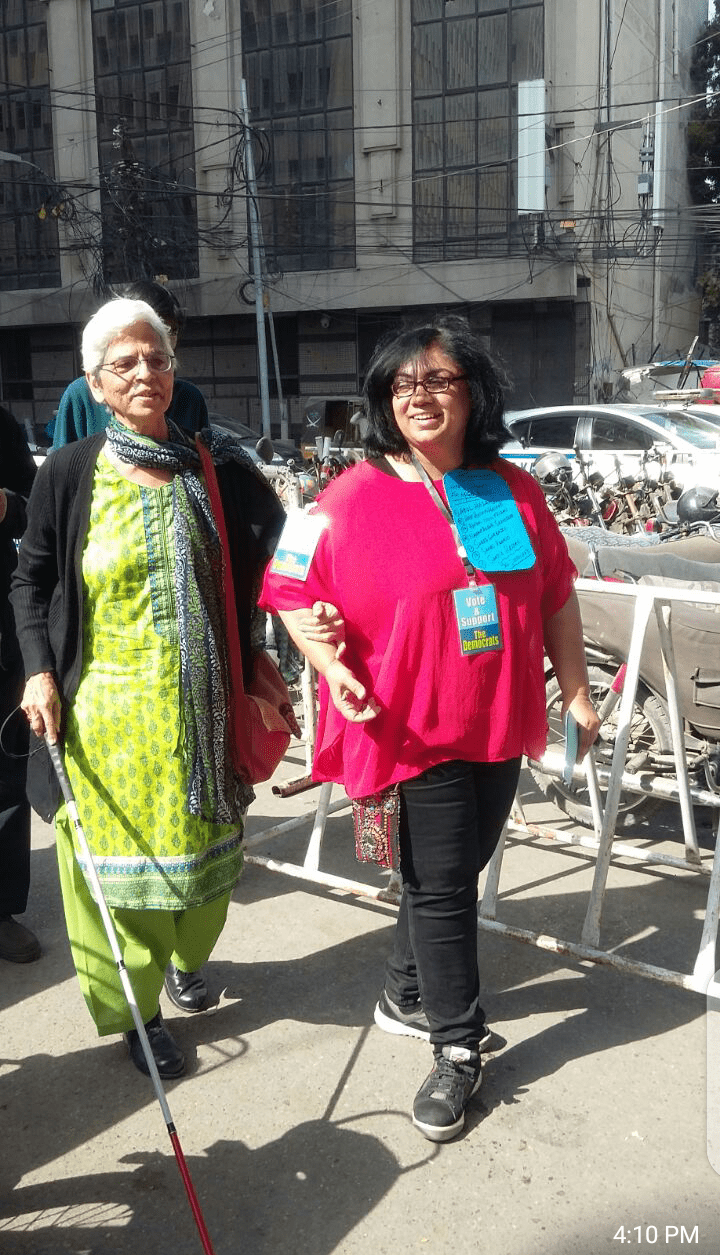  The writer with her mentor on election day at the Karachi Press Club in December 2017. &mdash; Photo by Zafar Ahmed Khan