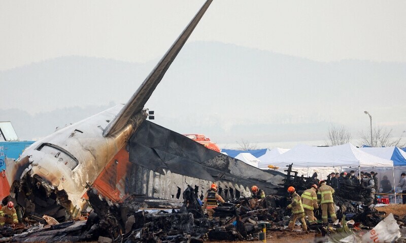 People work at the site where an aircraft went off the runway and crashed at Muan International Airport, in Muan, South Korea, December 30, 2024. &mdash; Reuters/File