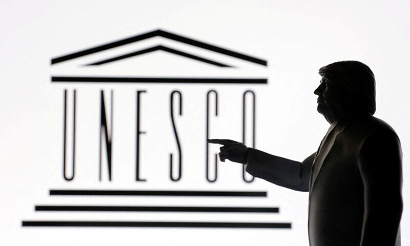 A 3D-printed miniature model of US President Donald Trump with the Unesco logo in the background is seen in this illustration taken on April 23. &mdash; Reuters