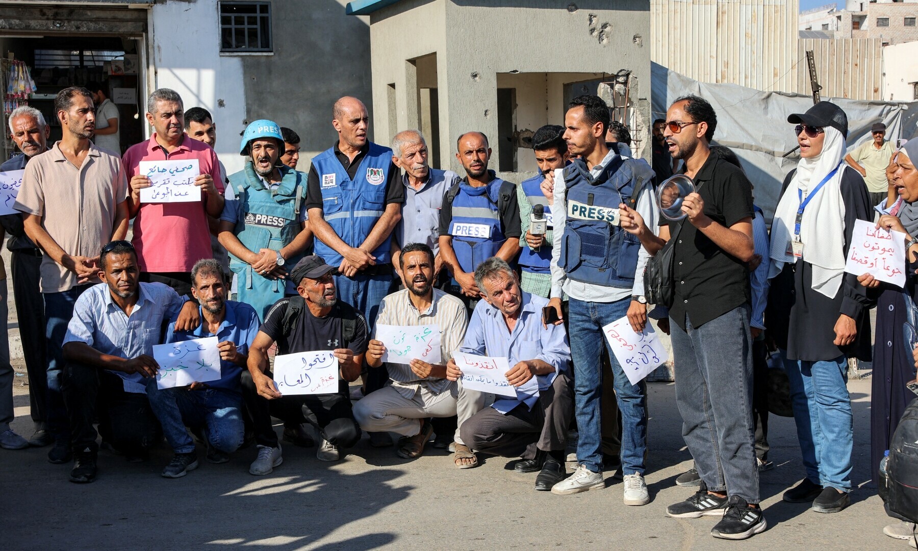  Demonstrators and journalists gather to protest against hunger in the Rimal district of Gaza City on July 19, 2025. &mdash; AFP/ Omar Al-Qattaa 
