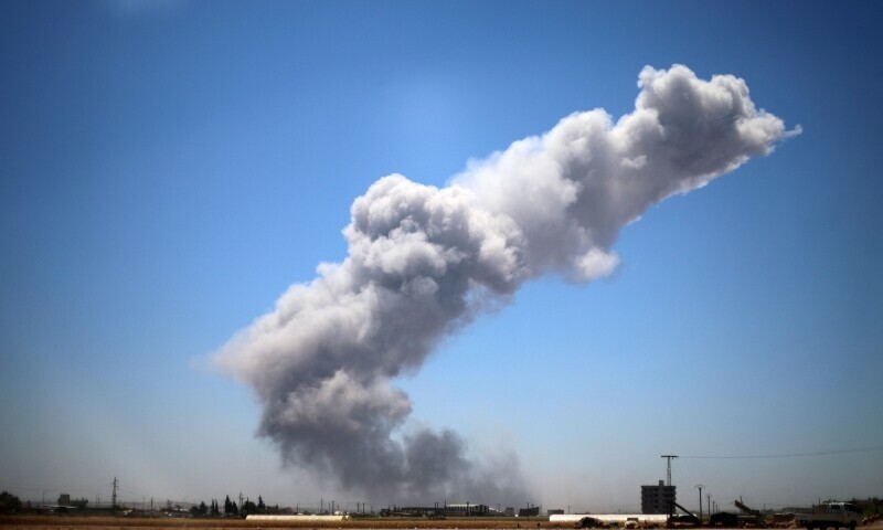 A plume of smoke rises following an explosion in Maarrat Misrin in the northern part of Syria’s Idlib governorate on July 24. — AFP A plume of smoke rises following an explosion in Maarrat Misrin in the northern part of Syria’s Idlib governorate on July 24. — AFP