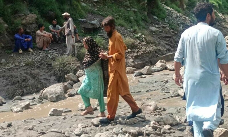 Rescue personnel engaged in rescue operation as landslides and floods trigged by heavy rain continue across GB. &mdash; Photo by Imtiaz Ali Taj