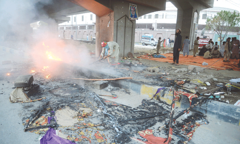 A PTI protest camp is in flames after it was torched during a demonstration against alleged corruption outside KP Assembly in
Peshawar on May 26.&mdash;White Star/Shahbaz Butt/File
