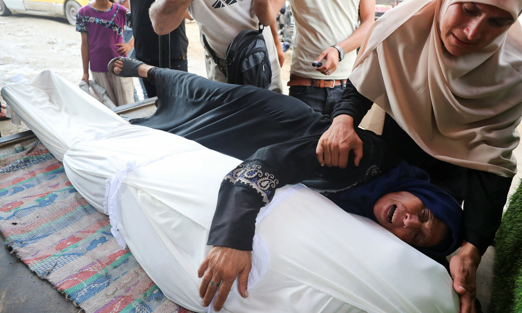 Women react at a funeral of Palestinians killed by Israeli fire while trying to receive aid and others who were killed in an overnight Israeli strike, according to medics, at Al-Shifa Hospital in Gaza City on July 26, 2025. — Reuters/Mahmoud Issa