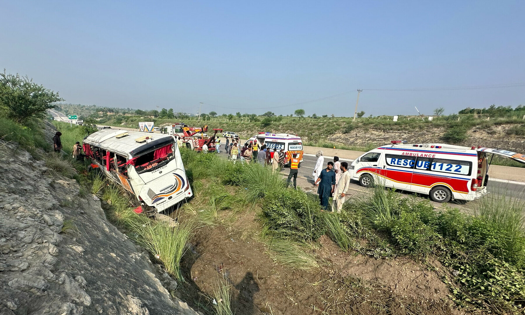 At least nine were dead as a bus heading to Lahore from Islamabad overturned after its tyre burst near the Balkassar Interchange on July 27, 2025. — Rescue 1122