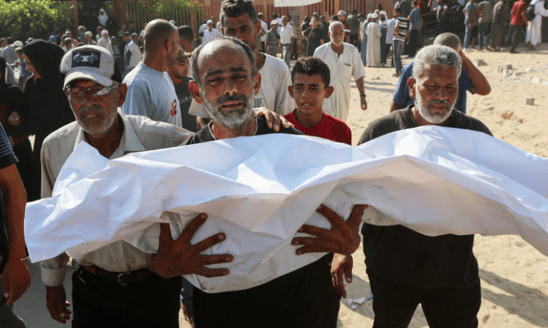  A mourner carries the body of a Palestinian killed in an overnight Israeli strike, according to medics, during a funeral at Nasser hospital, in Khan Younis in the southern Gaza Strip on July 28, 2025. &mdash; Reuters 