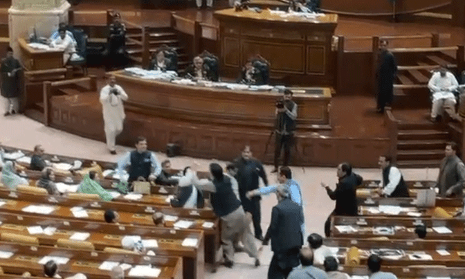 Opposition MPA Khalid Nisar Dogar strikes government MPA Hasan Riaz during a session of the Punjab Assembly in Lahore on July 28. &mdash; DawnNewsTV