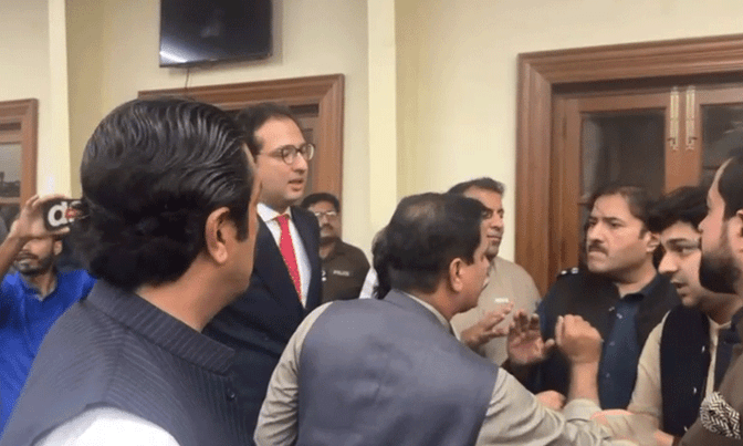 Government and opposition MPAs argue in the press hall of the Punjab Assembly in Lahore on July 28. &mdash; DawnNewsTV