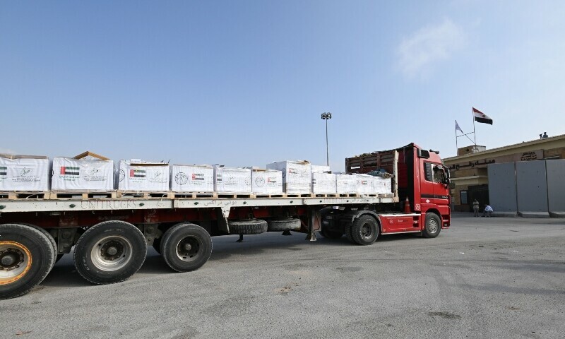 A truck carrying humanitarian aid, supplied by UAE AID, waiting to be allowed to cross from the Egyptian side of the Rafah border crossing with the Gaza Strip on July 28. &mdash; AFP