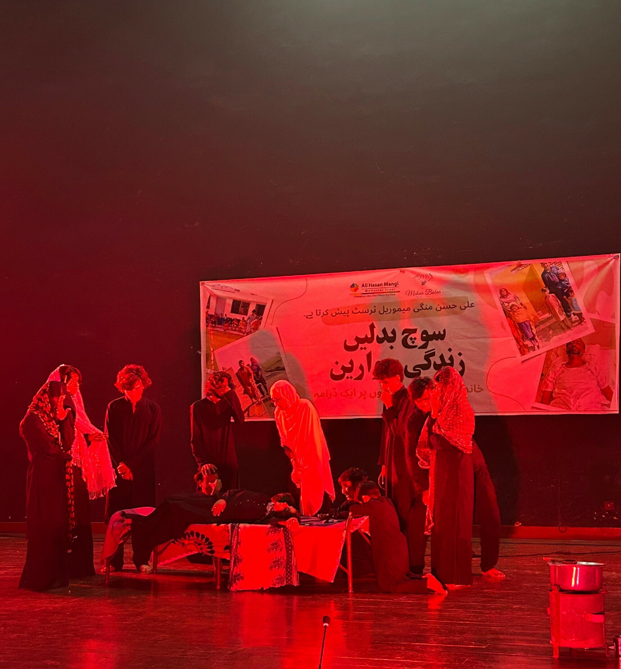  Scene from the play showing an overworked mother passing out from exhaustion. Photo: Author 