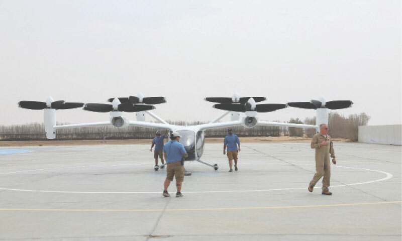 A PILOT walks while technicians handle an experimental Joby Dubai aerial taxi aircraft after it landed in Dubai.&mdash;Reuters