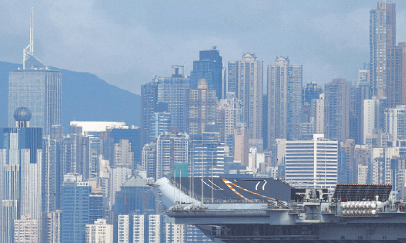 CHINA’s first domestically built aircraft carrier sits anchored after arriving in Hong Kong.—AFP