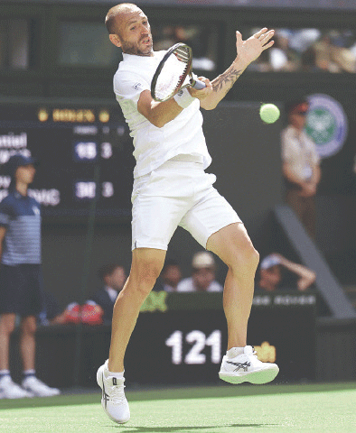  BRITAIN’S Daniel Evans in action during his second-round match against Novak Djokovic of Serbia on Thursday.—Reuters 