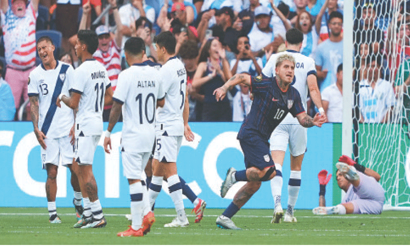 DIEGO Luna (R) of the US celebrates after scoring against Guatemala during their Gold Cup semi-final at the Energizer Park.—AFP DIEGO Luna (R) of the US celebrates after scoring against Guatemala during their Gold Cup semi-final at the Energizer Park.—AFP