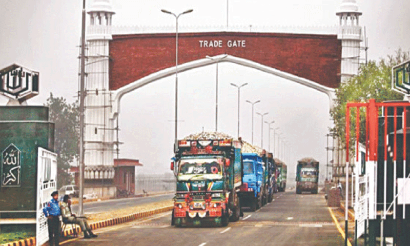 Trucks cross into Pakistan through the Wagah border.—Dawn/ file