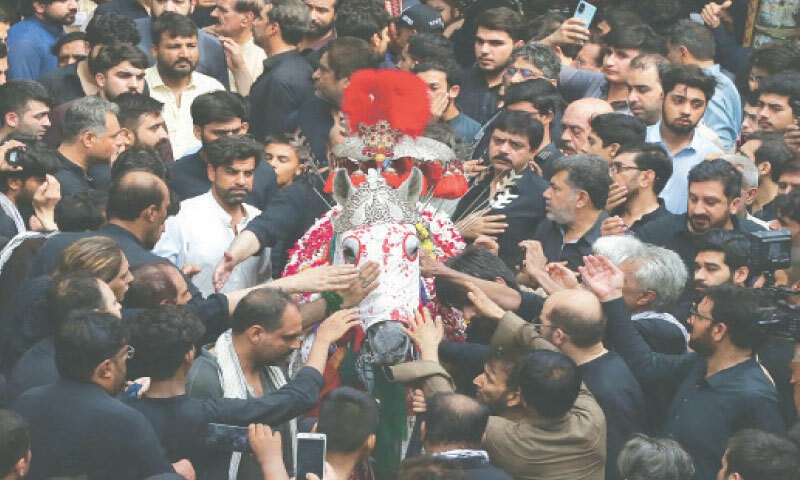 An Ashura procession passes through Qissa Khwani Bazaar, Peshawar. — White Star