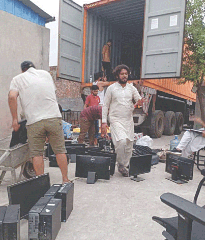 TOBA TEK SINGH: Seized computers and other gadgets being loaded on a trailer. — Dawn 