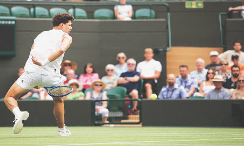 LONDON: Ben Shelton of the US plays a return to Italy’s Jannik Sinner during their Wimbledon quarter-final at the All England Lawn Tennis and Croquet Club on Wednesday.—AFP