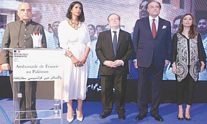 French Ambassador Nicolas Galey stands with Finance Minister Mohammad Aurangzeb during the 236th National Day of France celebrations in Islamabad on Friday. — White Star French Ambassador Nicolas Galey stands with Finance Minister Mohammad Aurangzeb during the 236th National Day of France celebrations in Islamabad on Friday. — White Star
