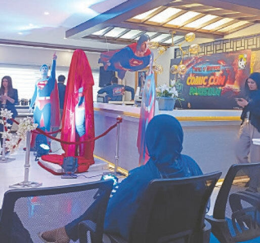 People wait for the unveiling of the Superman statue.—Dawn