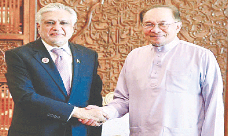 Deputy Prime Minister Ishaq Dar meets Malaysian PM Anwar Ibrahim.—APP