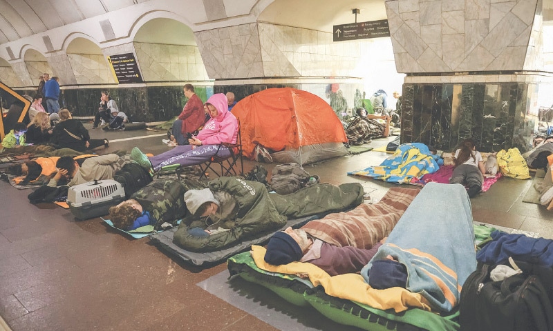 People take shelter inside a metro station during a Russian drone and missile strike in Kyiv on Saturday.—Reuters