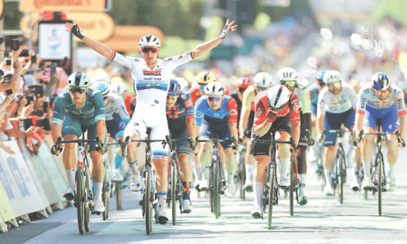 SOUDAL Quick-Step’s Tim Merlier of Belgium celebrates as he wins the ninth stage of the Tour de France on Sunday.—Reuters