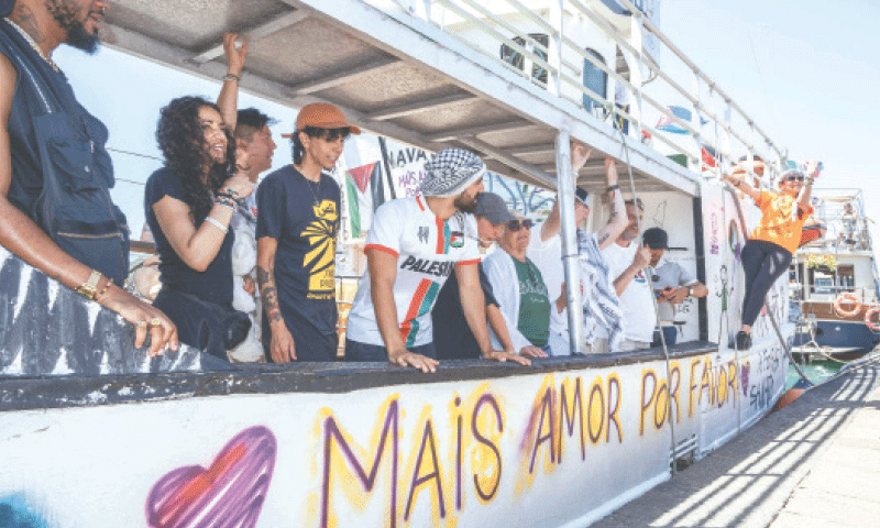 SYRACUSE (Italy): Crew members attend the ceremony to send off Freedom Flotilla boat ‘Handala’, which is currently heading to Gaza.—AFP