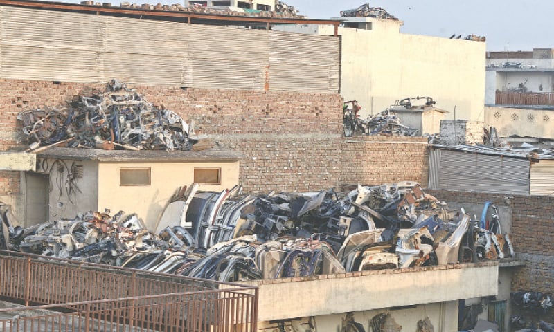 Vehicles’ body parts have been stored on the rooftops of buildings. — Photos by Mohammad Asim Vehicles’ body parts have been stored on the rooftops of buildings. — Photos by Mohammad Asim