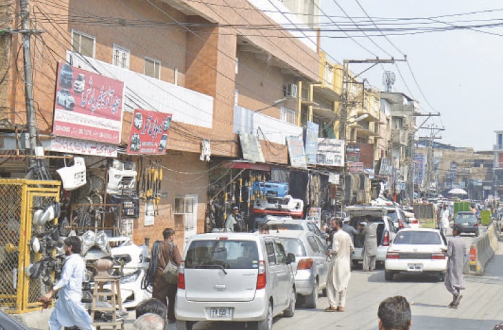 People have parked their cars outside shops to replace their vehicles’ damaged parts. — Photos by Mohammad Asim