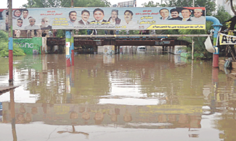 THE underpass beneath the railway bridge linking Hyderabad with Latifabad is completely drowned in rainwater.&mdash;Photo by Umair Ali