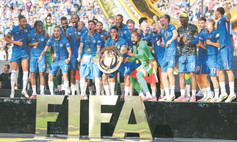 CHELSEA players celebrate with the Club World Cup trophy.—AFP