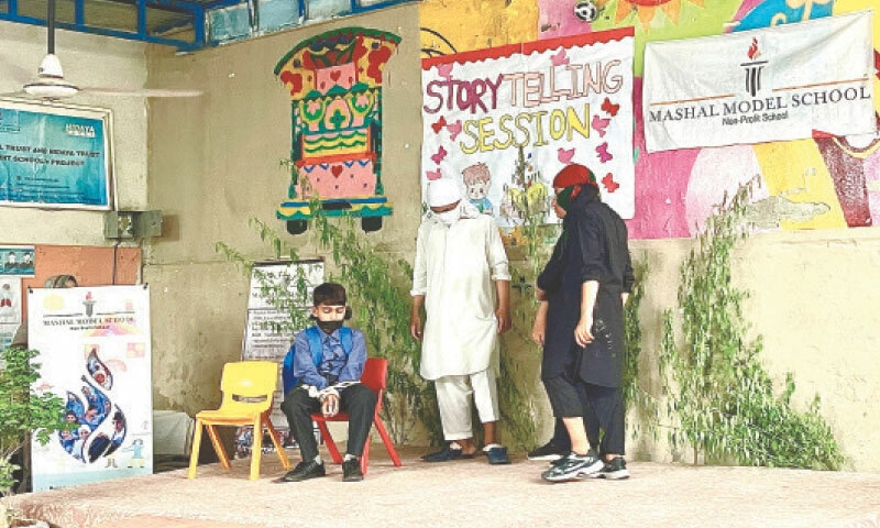 Children perform tableau during the story-telling session at Mashal Model School in Bari Imam in Islamabad on Tuesday. — Dawn