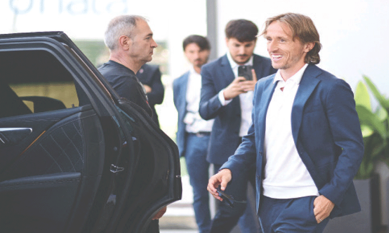 LUKA Modric smiles after his arrival in Milan.—Reuters