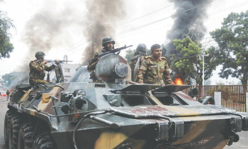 Gopalganj: Soldiers sit atop an armoured personnel carrier as forces were deployed after clashes during a National Citizen Party rally on Wednesday.—Reuters