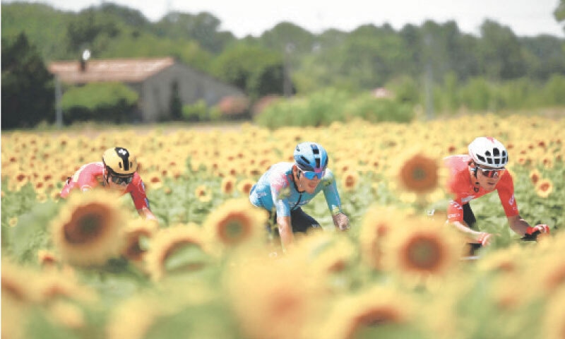 (From L) Uno-X Mobility team’s Norwegian rider Jonas Abrahamsen, XDS Astana Team’s Italian rider Davide Ballerini and Team Jayco AlUla team’s Swiss rider Mauro Schmid cycle in a breakaway during the 11th stage of the Tour de France on Wednesday.— AFP