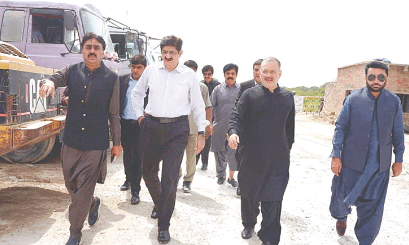 Sindh Chief Minister Syed Murad Ali Shah with provincial ministers Jam Khan Shoro (on his left) and Shajeel Inam Memon (on the right) visits the site of under-construction Abdul Sattar Edhi Flyover on Thursday.&mdash;Photo by Umair Ali