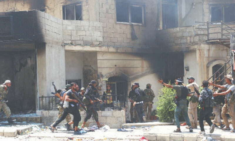 Beduin and tribal gunmen hold a position during clashes with Druze fighters in Syria’s southern city of Sweida, despite an announcement by the Syrian interim president of an ‘immediate ceasefire’ on Saturday.—AFP
