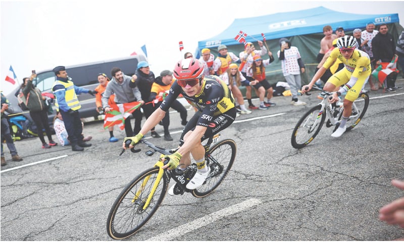 TEAM Visma-Lease a bike’s Danish rider Jonas Vingegaard (L) and UAE Team Emirates-XRG’s Tadej Pogacar of Slovenia, wearing the overall leader’s yellow jersey, cycle in the final ascent of Luchon-Superbagneres during the 14th stage of the Tour de France, a 182.6km distance from Pau and Luchon-Superbagneres in the Pyrenees mountains, on Saturday.—AFP TEAM Visma-Lease a bike’s Danish rider Jonas Vingegaard (L) and UAE Team Emirates-XRG’s Tadej Pogacar of Slovenia, wearing the overall leader’s yellow jersey, cycle in the final ascent of Luchon-Superbagneres during the 14th stage of the Tour de France, a 182.6km distance from Pau and Luchon-Superbagneres in the Pyrenees mountains, on Saturday.—AFP