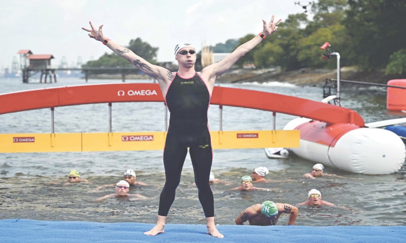 SINGAPORE: Germany’s Florian Wellbrock celebrates after winning the men’s 3km knockout sprint open water final during the World Aquatics Championships at Sentosa Island on Saturday.—AFP