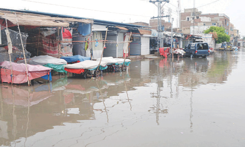 FLOODING causes closure of businesses along Makki Shah Road in Hyderabad.&mdash;Dawn