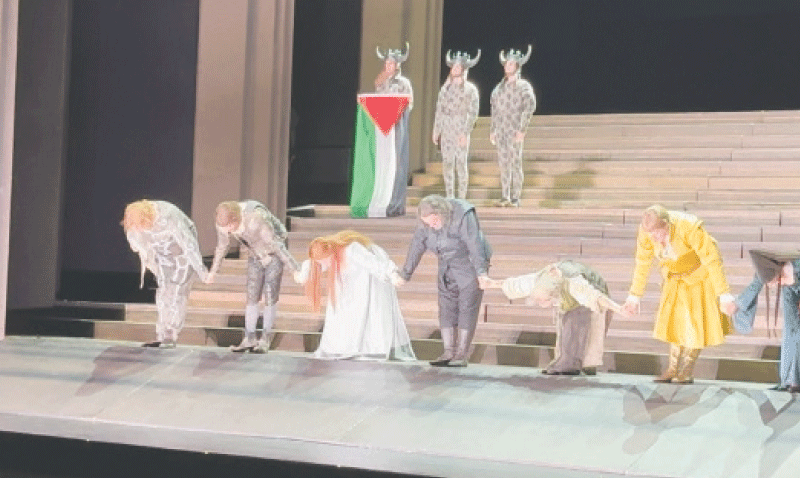 Cast members bow as one holds a Palestinian flag during the curtain call of Il Trovatore at the Royal Opera House in this video grab.&mdash;Reuters