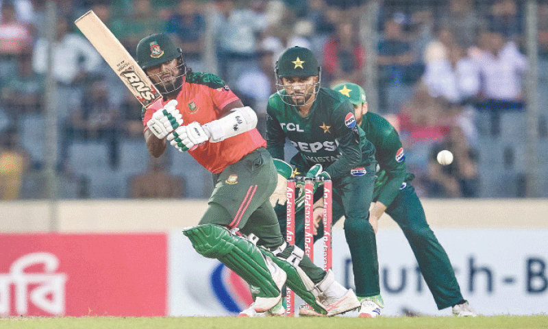 BANGLADESH batter Jaker Ali plays a shot as Pakistan wicket-keeper Mohammad Haris looks on during the second Twenty20 International at the Sher-e-Bangla National Cricket Stadium on Tuesday.&mdash;AFP