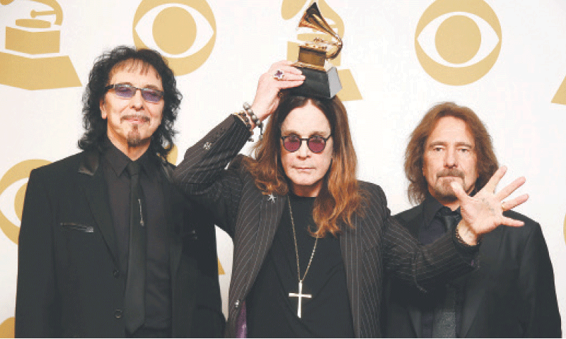 BLACK Sabbath members Tony Iommi, Ozzy Osbourne and Geezer Butler pose after winning an award at the 56th Grammy Awards, in 2014.&mdash;Reuters/file