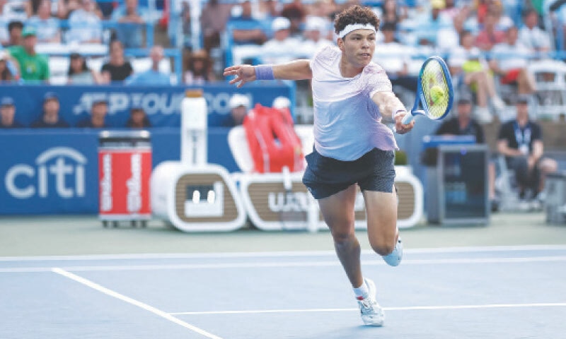 WASHINGTON: Ben Shelton of the US plays a return against compatriot Mackenzie McDonald during their Washington Open match at the William H.G. FitzGerald Tennis Center.&mdash;AFP
