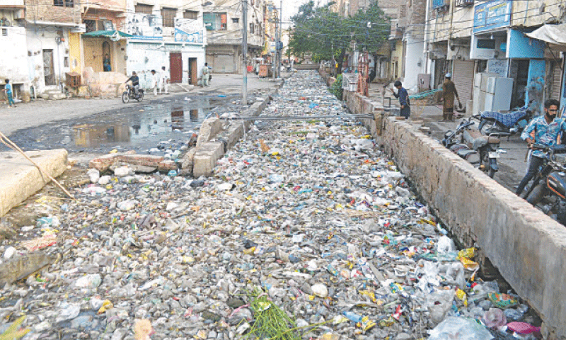 THE storm water drain is covered with solid waste as it passes through Gurunagar and Talab No.3 localities.&mdash;Umair Ali
